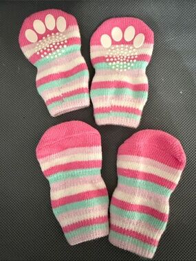 Pink, blue, & white striped pet socks feature rubberized grip pads